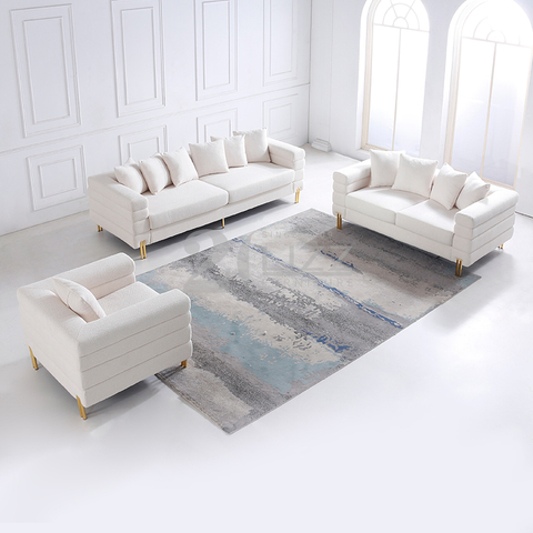 Canapé de luxe contemporain en tissu avec pieds dorés