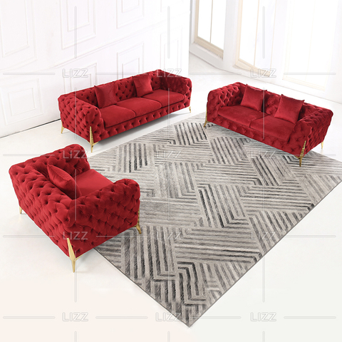 Canapé contemporain en tissu capitonné avec pieds dorés